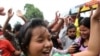 A Unified Communist Party of Nepal (Maoist) supporter dances during an indefinite nationwide general strike by Maoist in Kathmandu on 2 May 2010