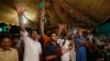 Supporters of Pakistani politician Imran Khan, chief of Pakistan Tehreek-e-Insaf party, celebrate projected unofficial results announced by television channels indicating their candidates' success in the parliamentary elections in Islamabad, Pakistan, Wednesday, Thursday, July 26, 2018.
