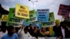FILE - Pakistani protesters stage a rally demanding a trial for American diplomat involved in a vehicle crash that killed a person, in Islamabad, Pakistan, April 10, 2018. Two people were injured Sunday in a second such incident involving a U.S. diplomat. 