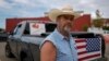 Cowboy David Graham, of Newark, Ohio, on hand with a message of support, stands near his truck across the street from City Hall, Sept. 17, 2024, in Springfield, Ohio.