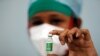 FILE PHOTO: A nurse displays a vial of COVISHIELD, the AstraZeneca COVID-19 vaccine manufactured by Serum Institute of India, in Mumbai
