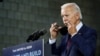 FILE - Democratic presidential candidate former Vice President Joe Biden puts on a face mask after speaking at an event in Lancaster, Pennsylvania, June 25, 2020.
