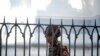A Myanmar soldier looks on as he stands inside city hall after soldiers occupied the building, in Yangon, Myanmar, Feb. 2, 2021. 