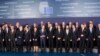 Heads of State and government pose for a group photo at an EU summit in Brussels, Feb. 12, 2015. 
