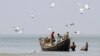 Fishermen catch fish at the shores of Bay of Bengal at Dublar Char in the Sundarbans, Bangladesh, November 10, 2011. 