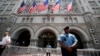 FILE - Law enforcement officers stand guard in front of the Trump Hotel in Washington, June 30, 2018.