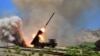 FILE - A view of a multiple rocket launcher during an exercise in this undated photo released by North Korea's Korean Central News Agency (KCNA) in Pyongyang.