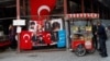 FILE - A street vendor sells baked products in Istanbul, Turkey, Nov. 8, 2017. Turkey’s jobless rate has surged to 13.5 percent, the highest since 2010.