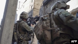 Esta imagen publicada por el ejército israelí el 22 de enero de 2024 muestra a soldados israelíes operando en la Franja de Gaza.