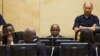FILE - Congolese ex-militia boss Mathieu Ngudjolo (C) waits for the verdict on his trial at the International Criminal Court in The Hague, December 18, 2012.