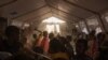 Tigray refugee children sing and dance inside a tent run by UNICEF for children's activities, in Umm Rakouba refugee camp in Qadarif, eastern Sudan, Dec. 10, 2020.