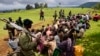 Congolese soldiers guard suspected M23 rebel fighters who surrendered in Chanzo village in the Rutshuru territory near the eastern town of Goma, November 5, 2013.