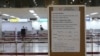 A Japan Airlines notice is displayed at Gimpo Airport in Seoul, South Korea, March 7, 2020.