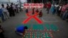 Children light candles during an HIV/AIDS awareness campaign on the occasion of World AIDS Day in Kolkata, India, December 1, 2017.