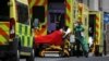 Medical workers transport a patient from an ambulance at the Royal London Hospital amidst the spread of the coronavirus disease (COVID-19) pandemic, in London, Britain, Jan. 10, 2021. 