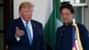 President Donald Trump gestures as he greets Pakistan's Prime Minister Imran Khan as he arrives at the White House, Monday, July 22, 2019, in Washington.