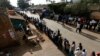 FILE - Kenyans wait to cast their vote at a polling station in Kibera slum in Nairobi March 4, 2013. 