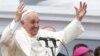 Pope Francis gestures while addressing the crowd from the Cathedral of Our Lady of the Assumption in Santiago, Cuba, Sept. 22, 2015. 