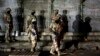 Pakistani paramilitary troops take up positions during a gunbattle with militants in Karachi, Pakistan, April 25, 2017. 