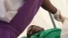 A patient suffering from HIV is taken to a local hospital in Harare, January 31, 2012. 