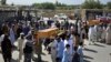 Men carry the coffin of a relative who died during Afghan forces' raid on a house in Chaparhar district of Nangarhar province, east of Kabul, Afghanistan, May 29, 2018.