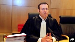 Criminal court President Nicolas Leger chairs the Rennes courtroom, western France, Monday, March 16, 2015.