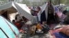 FILE - Internally displaced Afghans from northern provinces, who fled their home due to fighting between the Taliban and Afghan security personnel, take refuge in a public park Kabul, Afghanistan, Aug. 13, 2021.