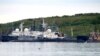 A picture taken July 2, 2019, shows an unidentified submarine in the port of Severomorsk, in Russia.