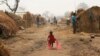 FILE - A child walks through a refugee camp in Kaga-Bandoro, Central African Republic, Feb. 16, 2016.
