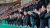 North Korean leader Kim Jong Un gestures during a men's football match between Sonbong and Hwoebul teams for the Mangyongdae Prize Sports Games at Kim Il Sung Stadium, in this undated photo released by North Korea's Korean Central News Agency April 14, 2015. 