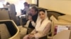Ousted Pakistani Prime Minister Nawaz Sharif and his daughter, Maryam, sit on a Lahore-bound flight due for departure, at Abu Dhabi International Airport, UAE, July 13, 2018. 