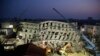 In the early morning, emergency rescuers continue to search for the missing in a collapsed building from an earthquake in Tainan, Taiwan, Feb. 7, 2016. 