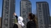 FILE - Kosovo Albanians read the names of the victims killed during the 1998-99 Kosovo war, as part of a ceremony marking the 18th anniversary of the massacre in the village of Izbica, March 28, 2017. 