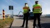 FILE - Members of the German federal police patrol along the German-Polish border area as part of efforts to detain migrants from Belarus, in Frankfurt-an-der-Oder, Germany, Oct. 28, 2021. 