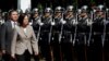 FILE - Taiwanese President Tsai Ing-wen inspects honor guard before a ceremony to mark the 92nd anniversary of the Whampoa Military Academy, in Kaohsiung, southern Taiwan, June 16, 2016.