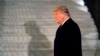 FILE - President Donald Trump arrives on the South Lawn of the White House, in Washington, Jan. 12, 2021.