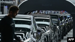 FILE - Electric vehicles at Tesla's "Gigafactory" plant on March 22, 2022 in Gruenheide, southeast of Berlin. Tesla halted production at its German factory on March 5, 2024, after someone set fire to high-voltage lines nearby, cutting power to the carmaker's only plant in Europe,