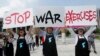 Protesters shout slogans to oppose planned joint military exercise between South Korea and the United States near the U.S. embassy in Seoul, South Korea, Aug. 5, 2019.