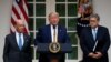 President Donald Trump, joined by Commerce Secretary Wilbur Ross, left, and Attorney General William Barr, speaks during an event about the census in the Rose Garden at the White House in Washington, July 11, 2019. 