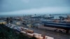 FILE - Trucks wait in lines to drive onto ferries at the Port of Dover, Britain, Feb. 1, 2020.