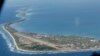 FILE - Funafuti, the main island of the nation state of Tuvalu, is photographed from a Royal New Zealand airforce C130 aircraft as it approaches the tiny South Pacific nation.