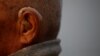 FILE - An 85-year-old Nepalese man is seen fitted with a hearing aid, in Kathmandu, Nepal, April 12, 2017.