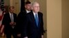 Senate Majority Leader Mitch McConnell of Ky. walks to the Senate Chamber on Capitol Hill in Washington, March 23, 2020, as the Senate is working to pass a coronavirus relief bill.