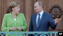 Almanya Başbakanı Angela Merkel ve Rusya Lideri Vladimir Putin.