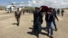 FILE - Relatives carry the coffin of an Afghan National Army soldier killed in a Taliban attack in Takhar province, Afghanistan, April 23, 2017. On Thursday, a Taliban raid in Takhar province killed 16 Afghan forces.