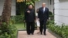 North Korea's leader Kim Jong Un and U.S. President Donald Trump talk in the garden of the Metropole hotel during the second North Korea-U.S. summit in Hanoi, Vietnam, Feb. 28, 2019.