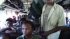Port-au-Prince residents board a bus to leave the capital city for safer rural areas in Haiti