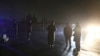 Security forces block a road at the site of a suicide bomb attack in Kabul, Afghanistan, Nov. 28, 2018. 